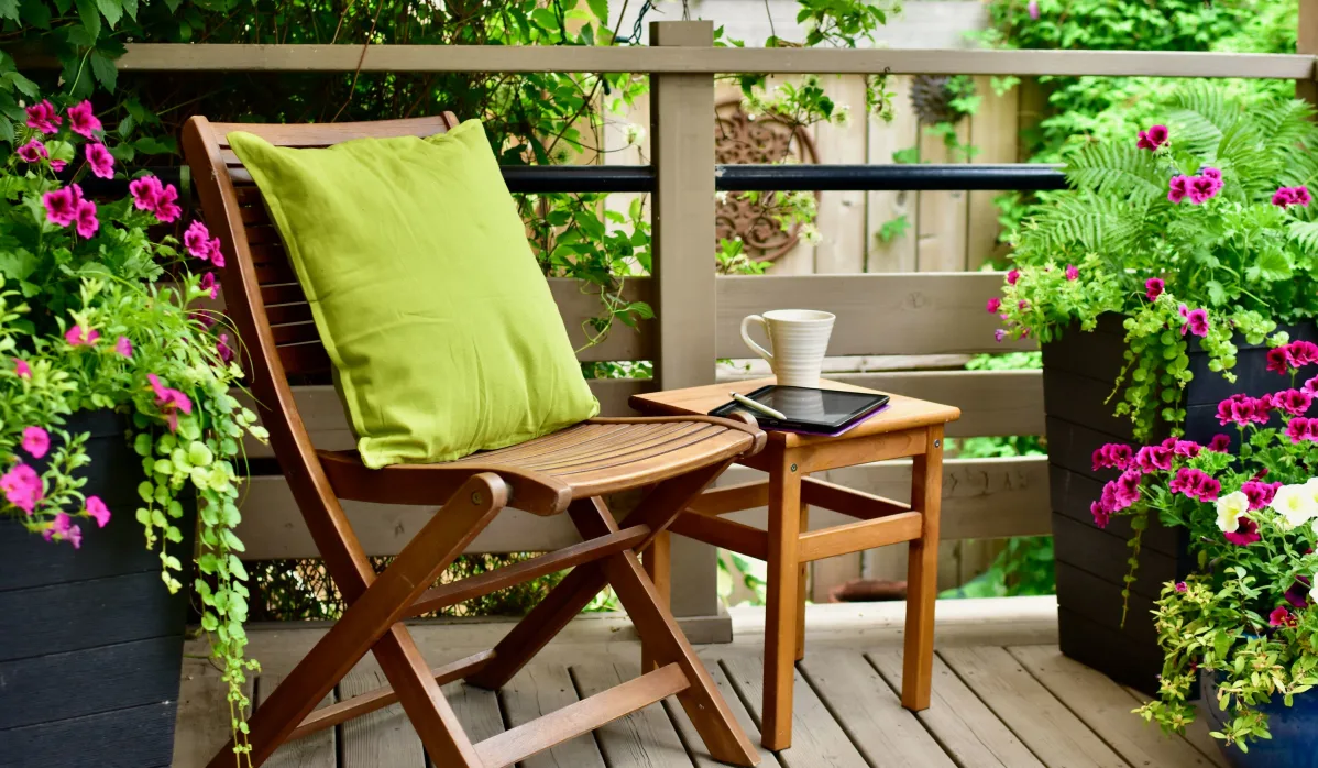 wooden chair with green pillow