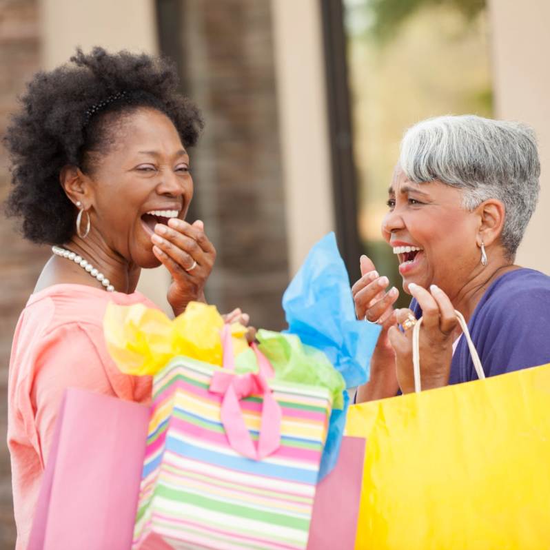 senior woman shopping and laughing